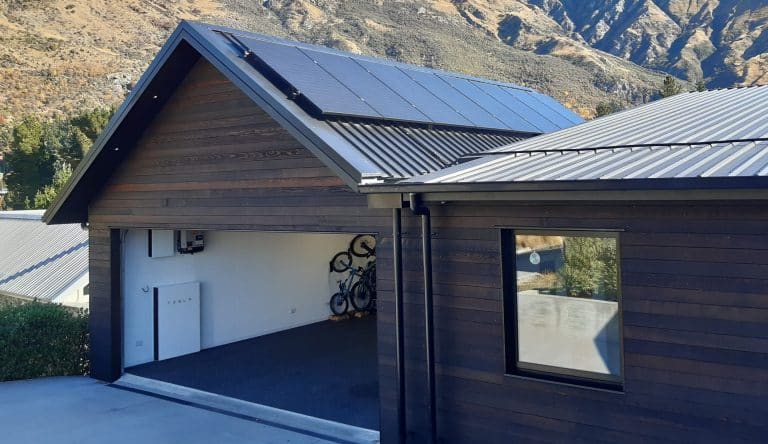Tesla Powerwall and Solar Panels on Garage  scaled e1688597931422