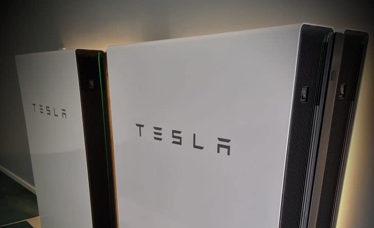 Tesla Powerwall backlit angle view 1 scaled e1682652880667